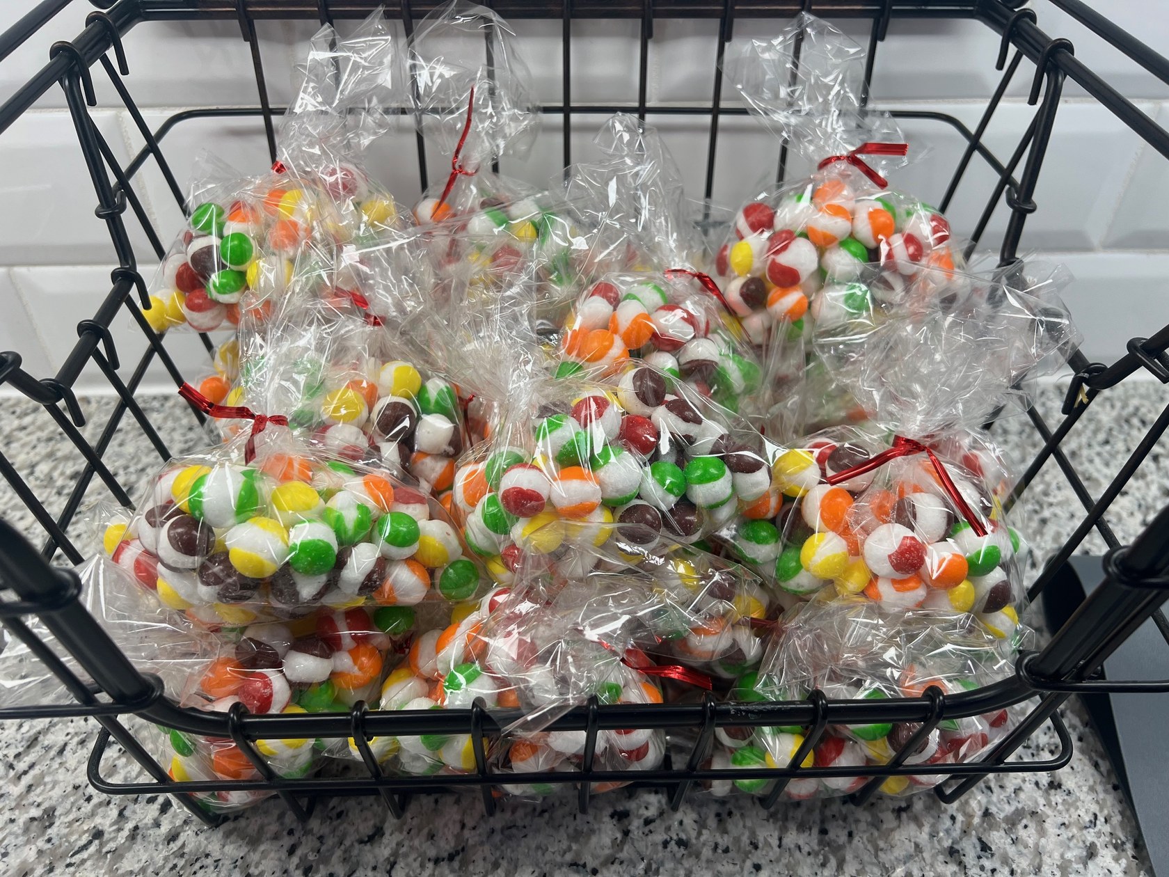 A basket full of bagged freeze dried candy, ready to enjoy